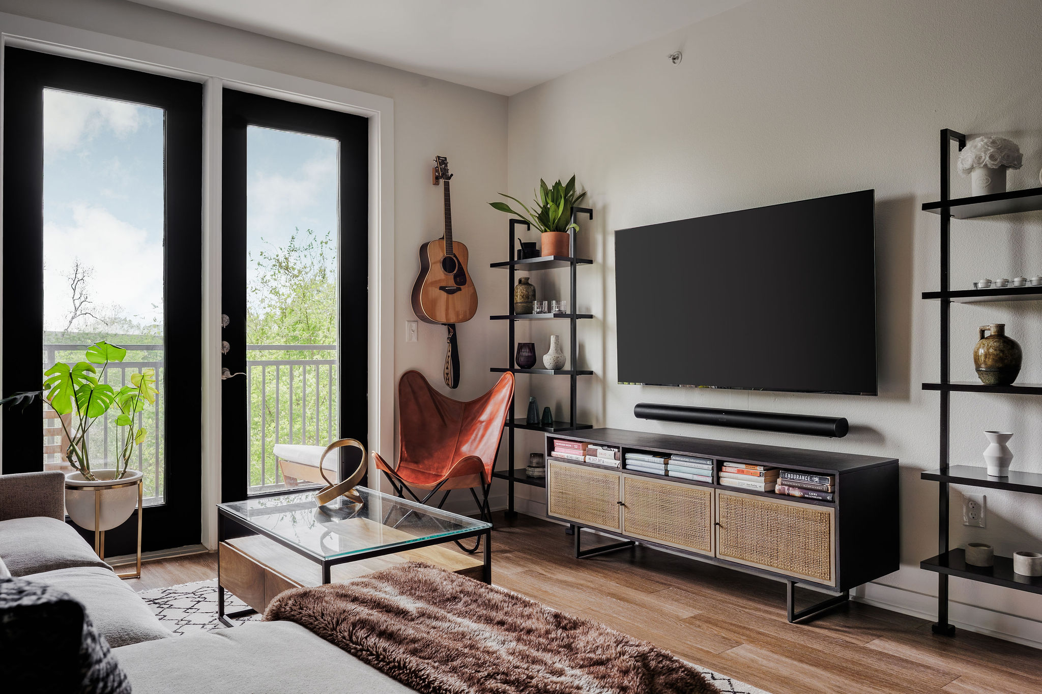 1900 Barton Springs Road, Unit 3028 Austin, TX 78704 - Photo 2 of 31 a living room with furniture and a flat screen tv