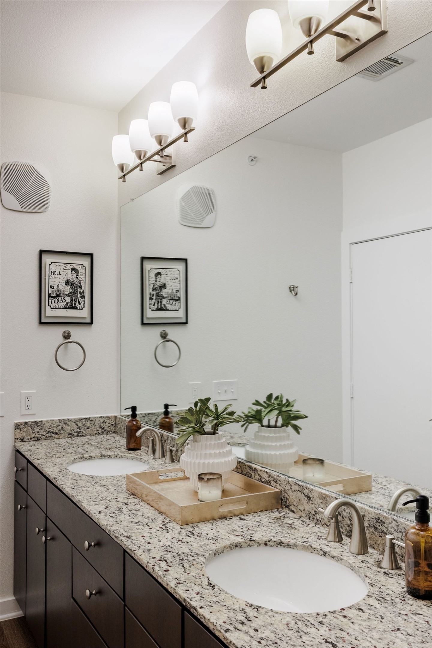 1900 Barton Springs Road, Unit 3028 Austin, TX 78704 - Photo 21 of 31 a bathroom with a granite countertop sink a mirror and vanity