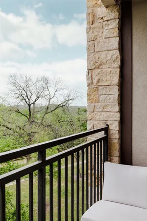 an aerial view of a house with outdoor space and lake view