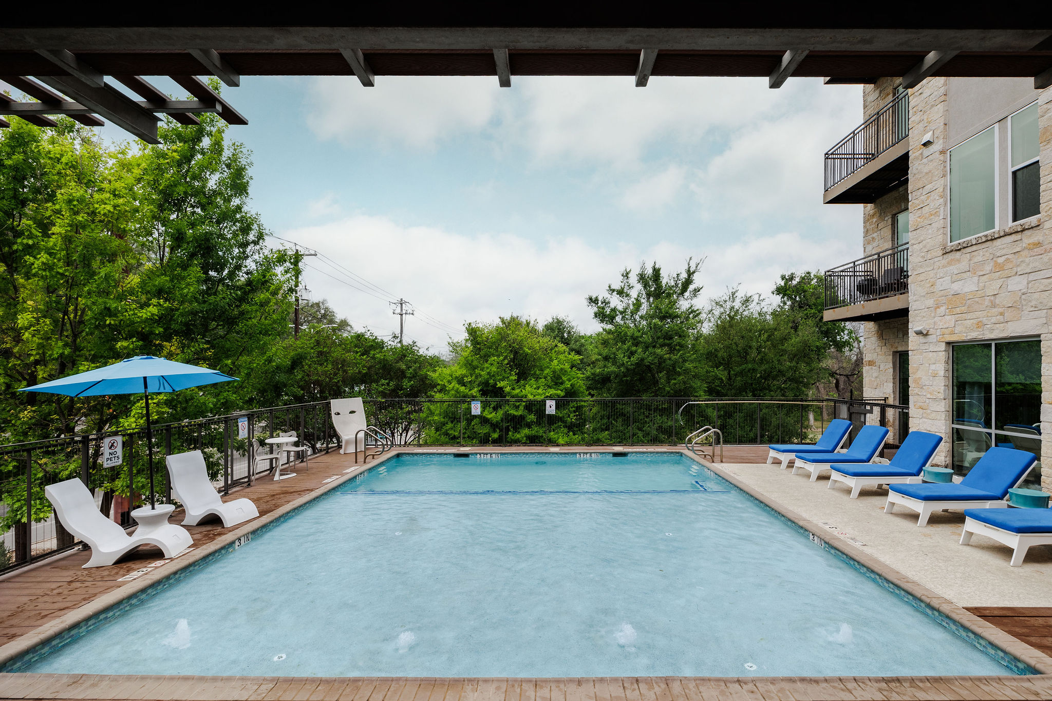 1900 Barton Springs Road, Unit 3028 Austin, TX 78704 - Photo 27 of 31 a view of a chairs and tables in the patio