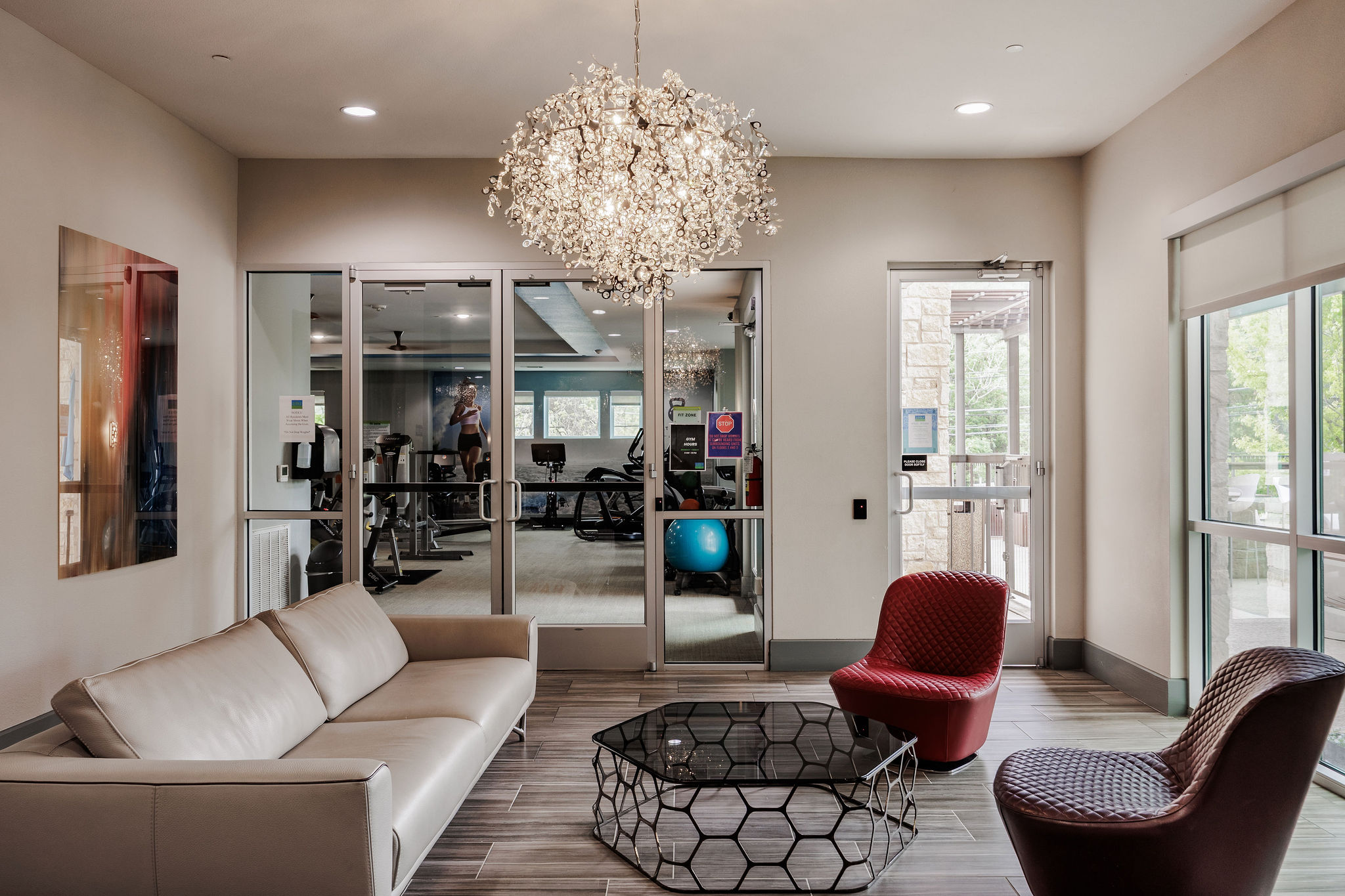 1900 Barton Springs Road, Unit 3028 Austin, TX 78704 - Photo 29 of 31 a living room with furniture a chandelier and a chandelier