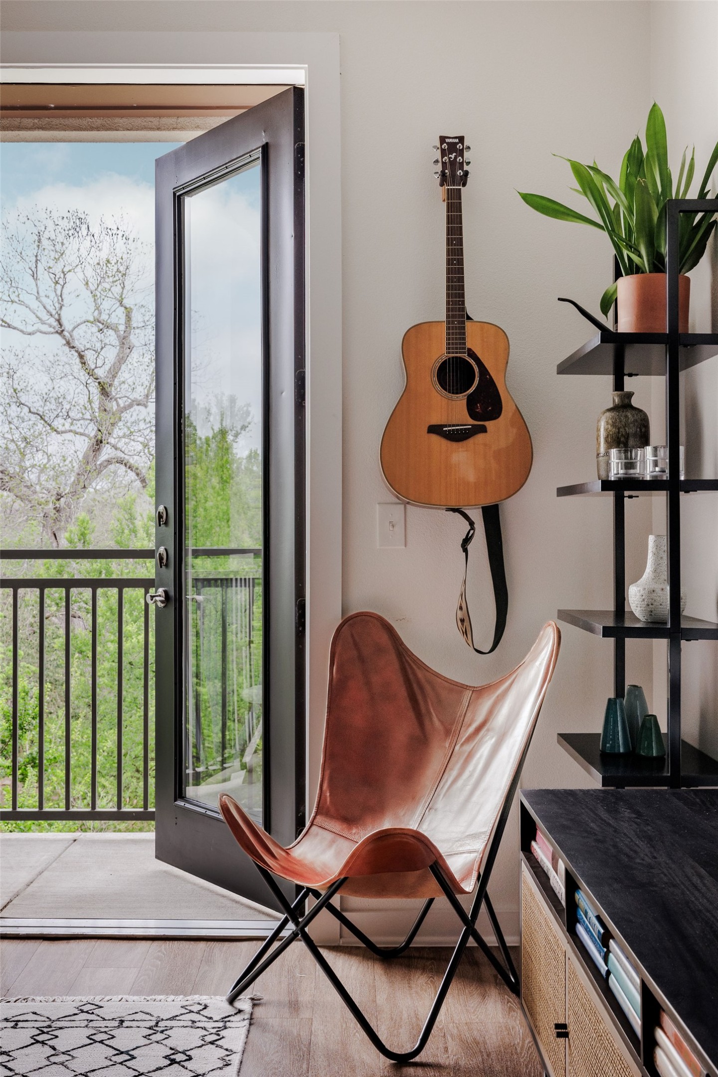 1900 Barton Springs Road, Unit 3028 Austin, TX 78704 - Photo 3 of 31 a table chair sitting in a room with a potted plant