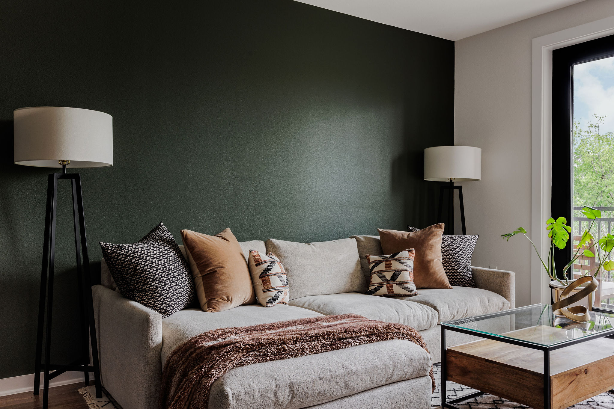 1900 Barton Springs Road, Unit 3028 Austin, TX 78704 - Photo 4 of 31 a living room with a couch and a lamp on table
