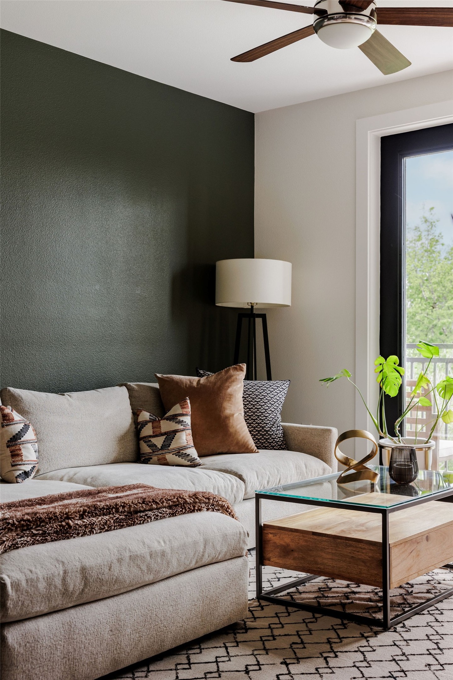 1900 Barton Springs Road, Unit 3028 Austin, TX 78704 - Photo 5 of 31 a living room with furniture and a lamp