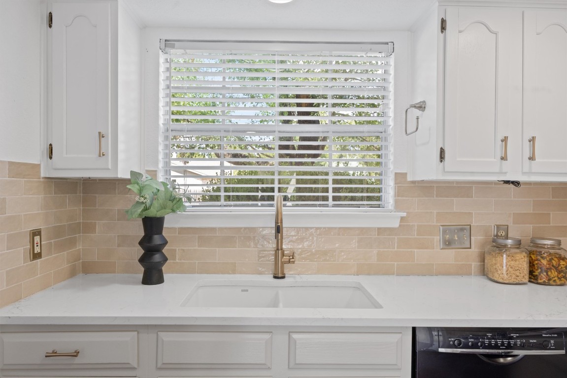 5217 Summerset Trail Austin, TX 78749 - Photo 11 of 38 a kitchen with a sink and white cabinets