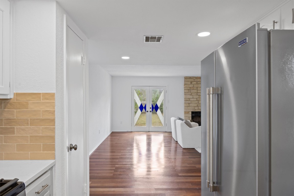 5217 Summerset Trail Austin, TX 78749 - Photo 14 of 38 a view of hallway with wooden floor and cabinets