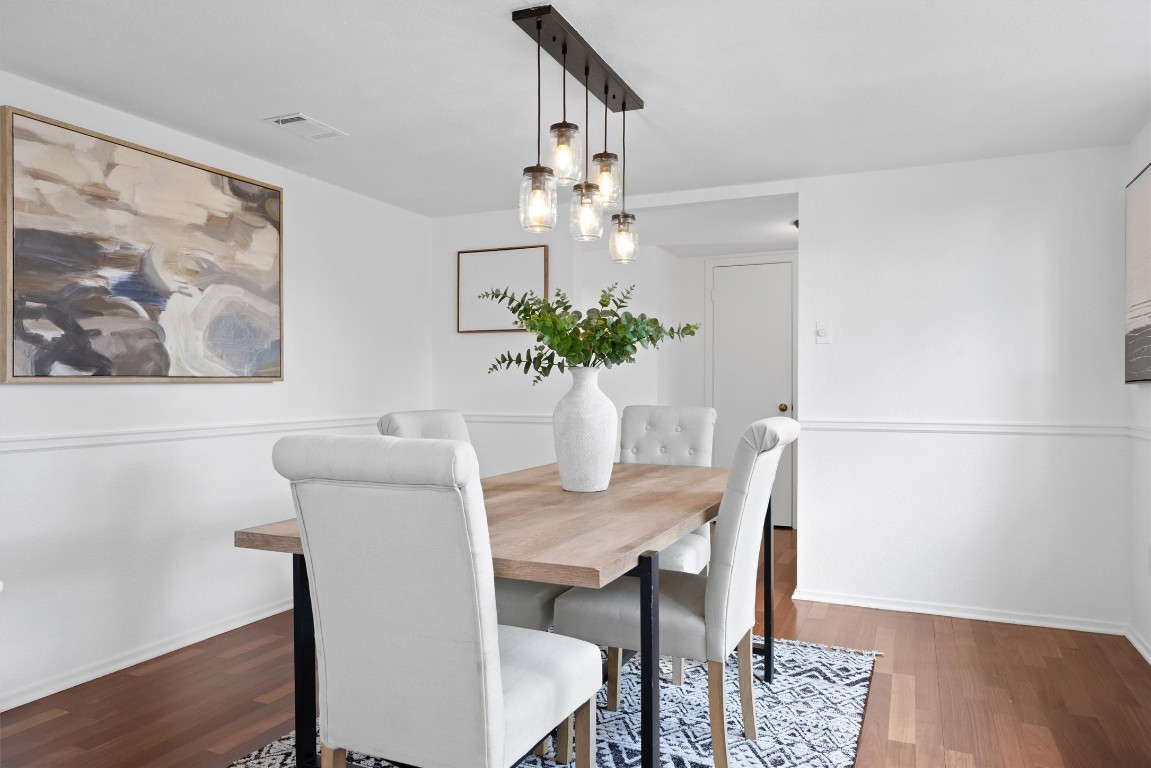 5217 Summerset Trail Austin, TX 78749 - Photo 16 of 38 a view of a dining room with furniture and wooden floor
