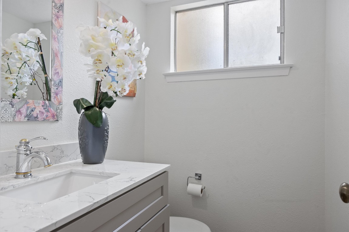 5217 Summerset Trail Austin, TX 78749 - Photo 18 of 38 a bathroom with a sink a toilet and a mirror