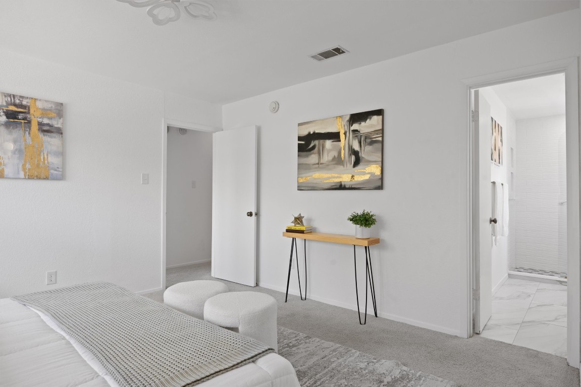 5217 Summerset Trail Austin, TX 78749 - Photo 32 of 38 a bedroom with a bed and a chair