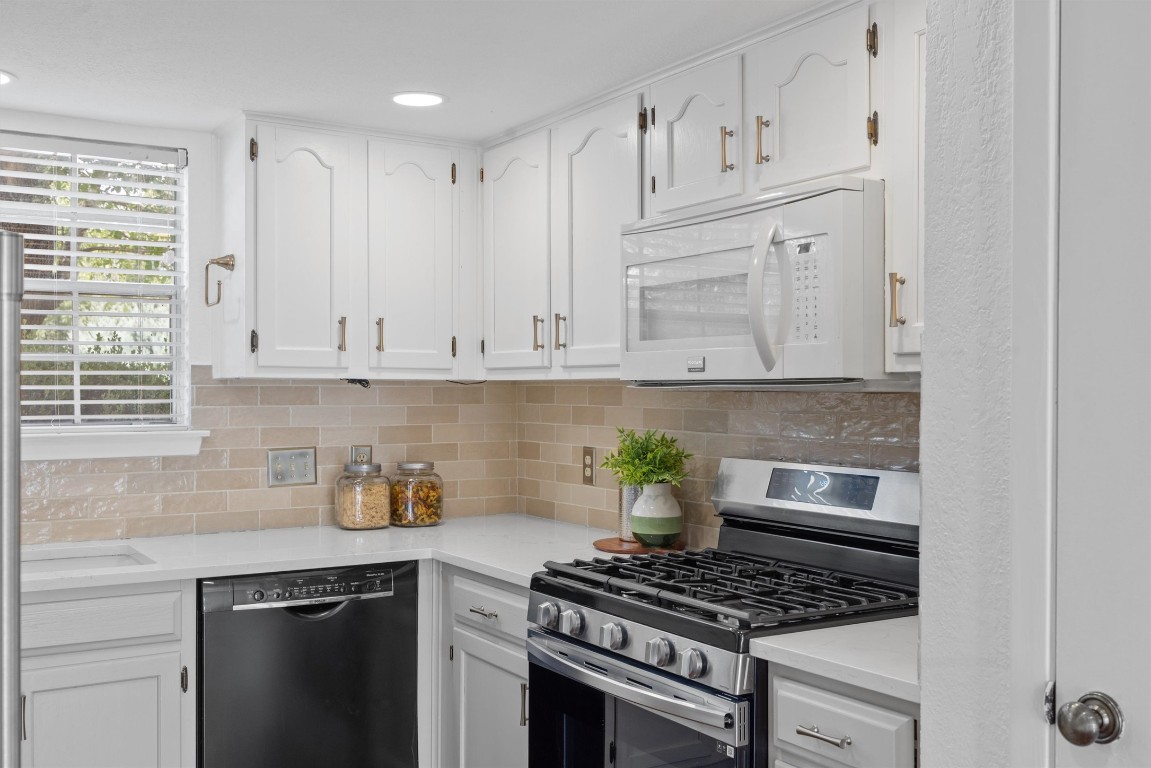 5217 Summerset Trail Austin, TX 78749 - Photo 10 of 38 a kitchen with white cabinets and appliances