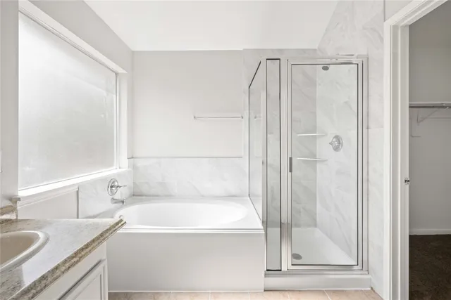 a bathroom with a tub and a sink