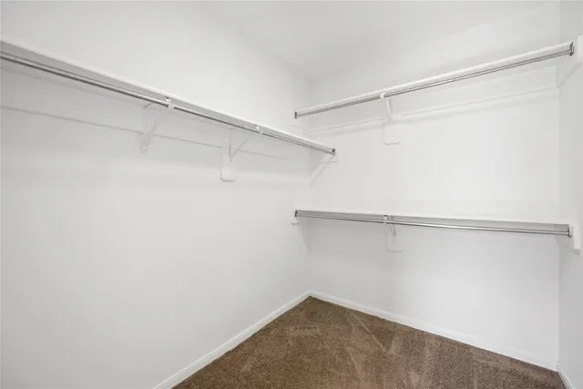 a view of a room with shelf on the wall