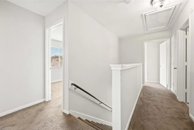 a view of a hallway with staircase