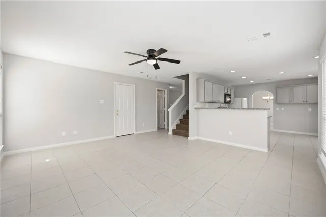 a view of a kitchen with a sink and a stove top oven