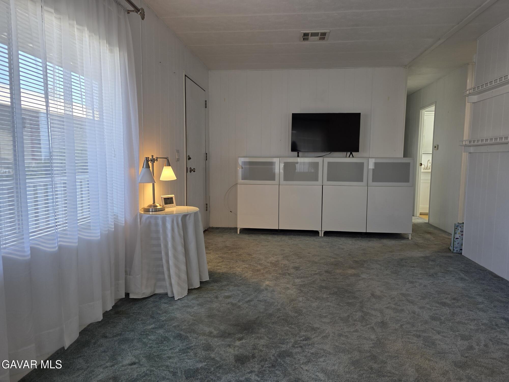 20806 Gridley Road Lakewood, CA 90715 - Photo 14 of 44 a view of a livingroom with an empty space