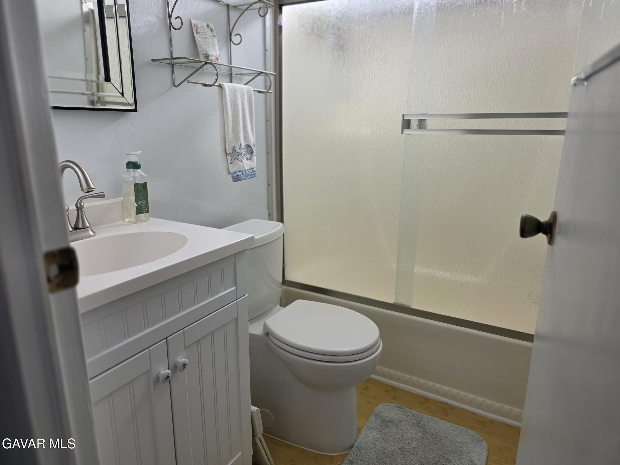 20806 Gridley Road Lakewood, CA 90715 - Photo 26 of 44 a bathroom with a sink toilet and shower