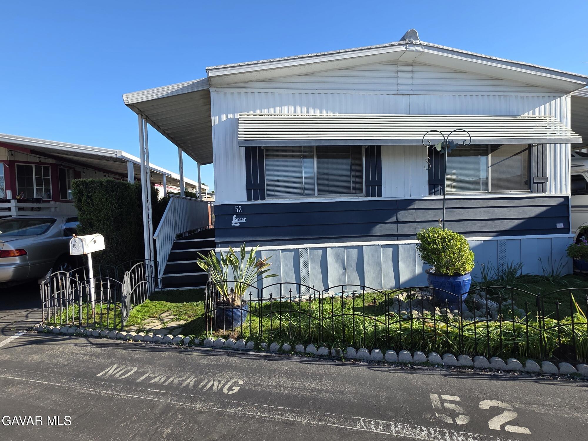 20806 Gridley Road Lakewood, CA 90715 - Photo 4 of 44 a front view of a house