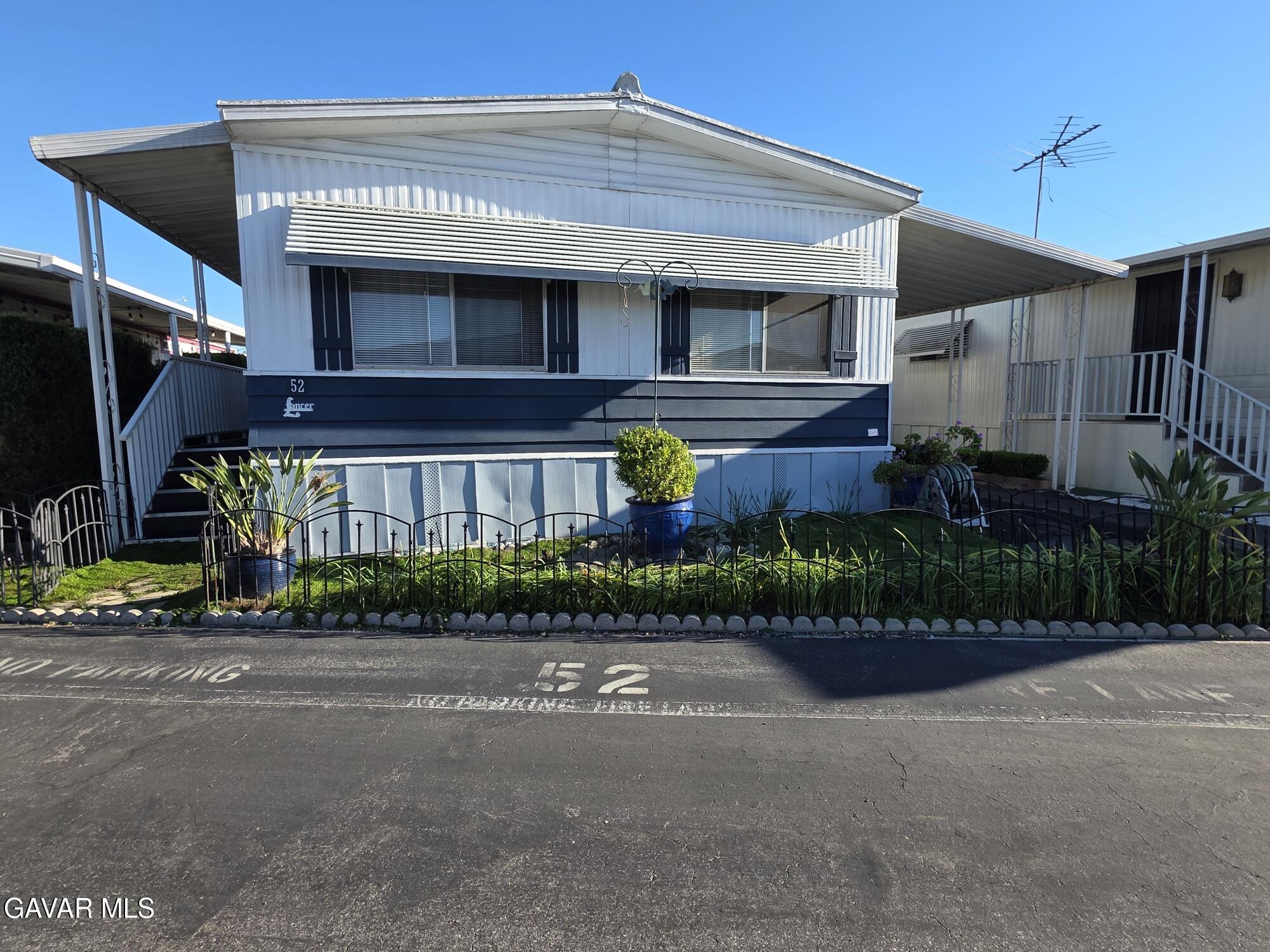 20806 Gridley Road Lakewood, CA 90715 - Photo 8 of 44 a front view of multiple houses