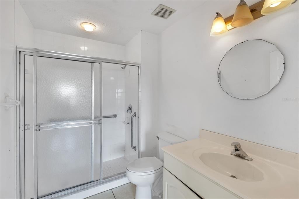 3730 Cadbury Circle, Unit 431 Venice, FL 34293 - Photo 17 of 34 a bathroom with a sink and a mirror