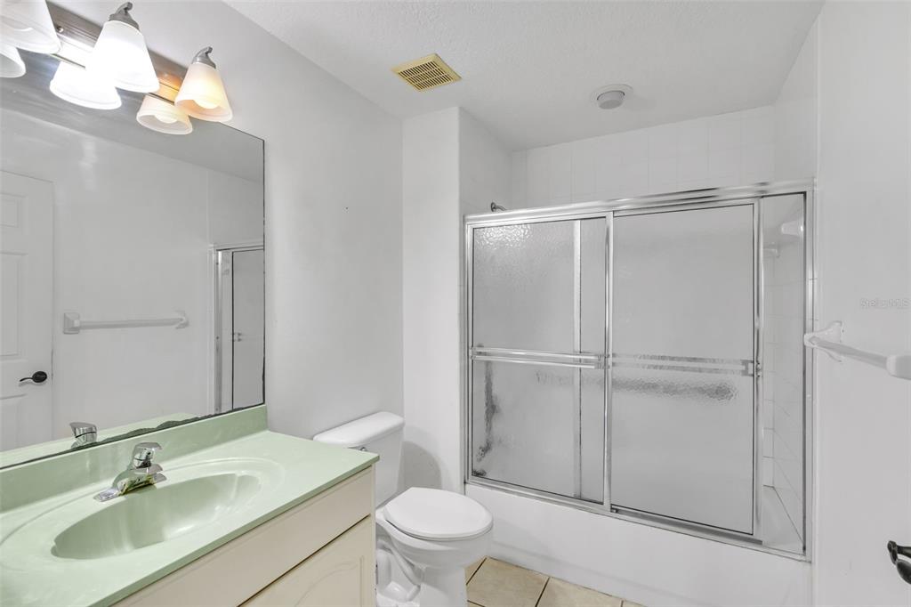 3730 Cadbury Circle, Unit 431 Venice, FL 34293 - Photo 23 of 34 a bathroom with a sink toilet and shower