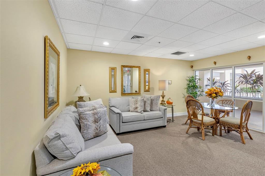 3730 Cadbury Circle, Unit 431 Venice, FL 34293 - Photo 28 of 34 a living room with furniture and a large window