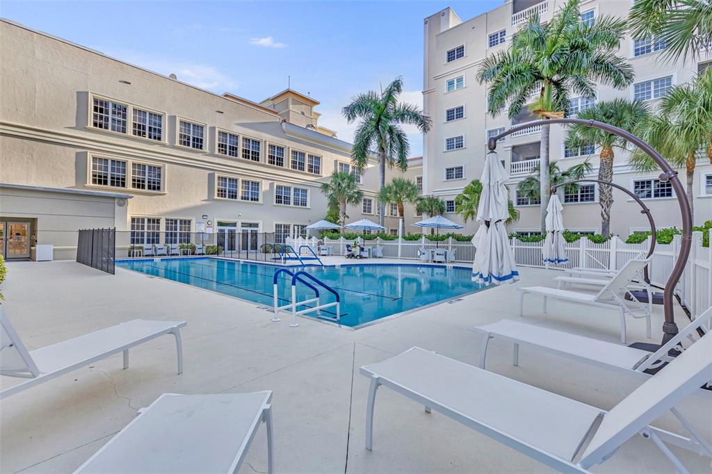 3730 Cadbury Circle, Unit 431 Venice, FL 34293 - Photo 30 of 34 a view of building with outdoor space and sitting area