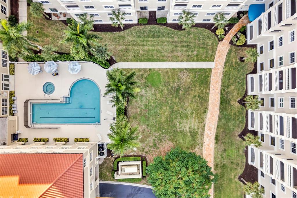 3730 Cadbury Circle, Unit 431 Venice, FL 34293 - Photo 34 of 34 a aerial view of a residential apartment building with a yard