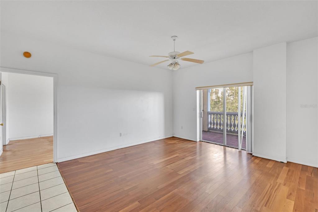 3730 Cadbury Circle, Unit 431 Venice, FL 34293 - Photo 8 of 34 wooden floor in an empty room with a window