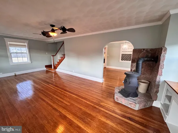 a view of a living room and wooden floor