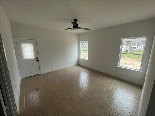 a view of an empty room with a window