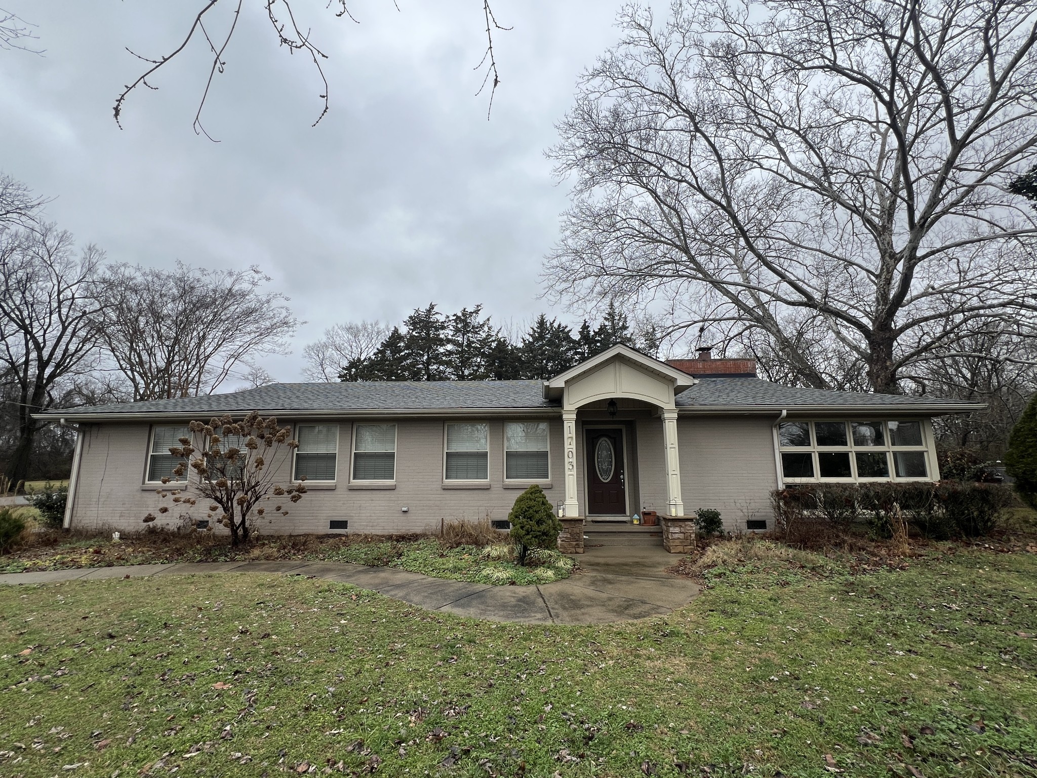 a front view of a house with garden