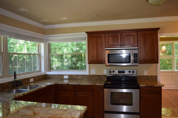 a kitchen with a stove and a sink