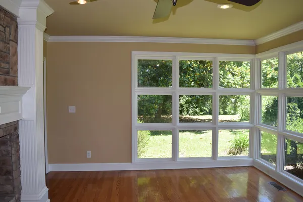 a view of room with window and a bed