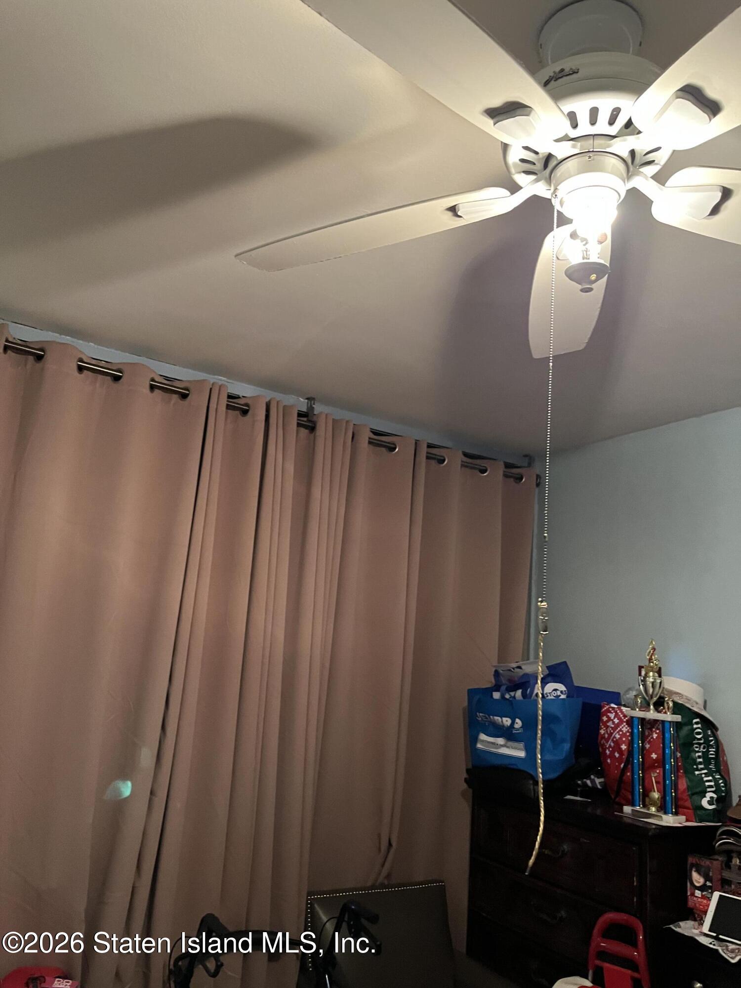 1000 Clove Road, Unit LD Staten Island, NY 10301 - Photo 17 of 21 a view of walk in closet with clothes and shoes