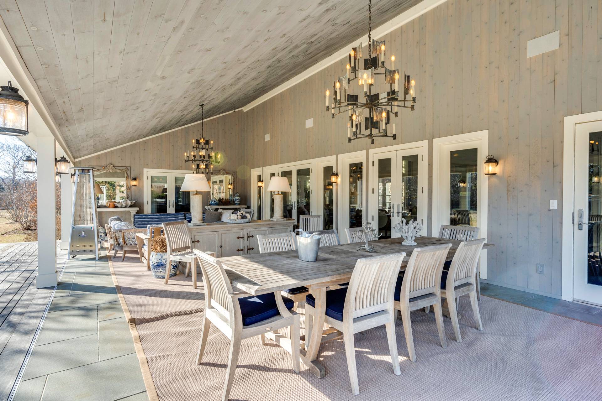 274 Ferry Road Sag Harbor, NY 11963 - Photo 14 of 50 a view of a dining room with furniture and chandelier