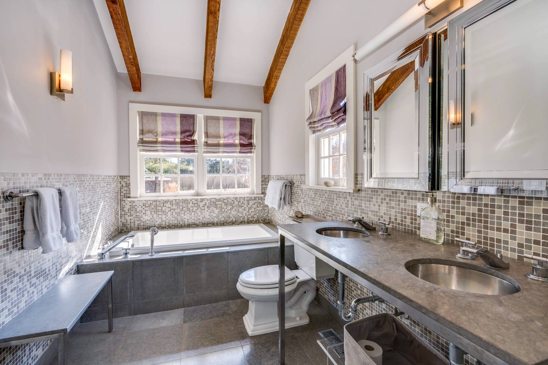 274 Ferry Road Sag Harbor, NY 11963 - Photo 24 of 50 a bathroom with a granite countertop sink and a large mirror