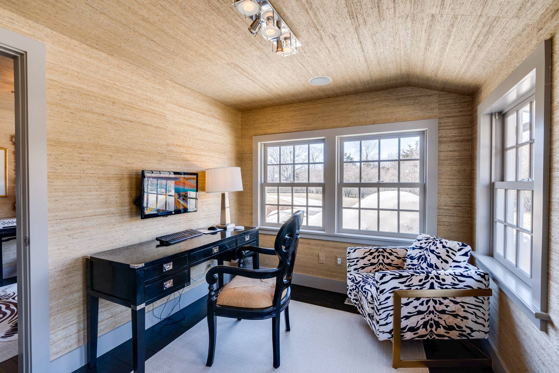 274 Ferry Road Sag Harbor, NY 11963 - Photo 26 of 50 a living room with furniture and a flat screen tv