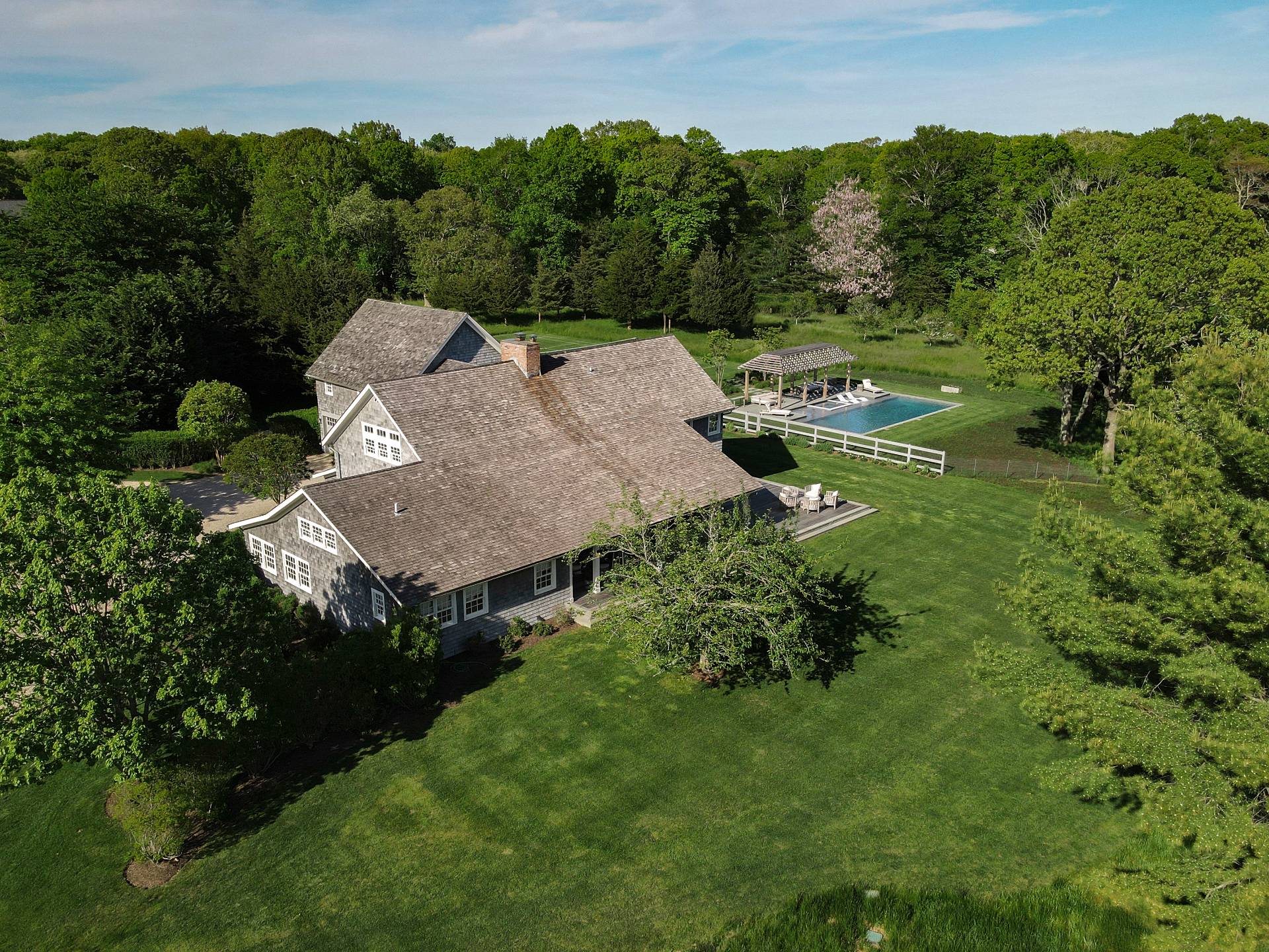 274 Ferry Road Sag Harbor, NY 11963 - Photo 4 of 50 an aerial view of a house with yard and outdoor seating
