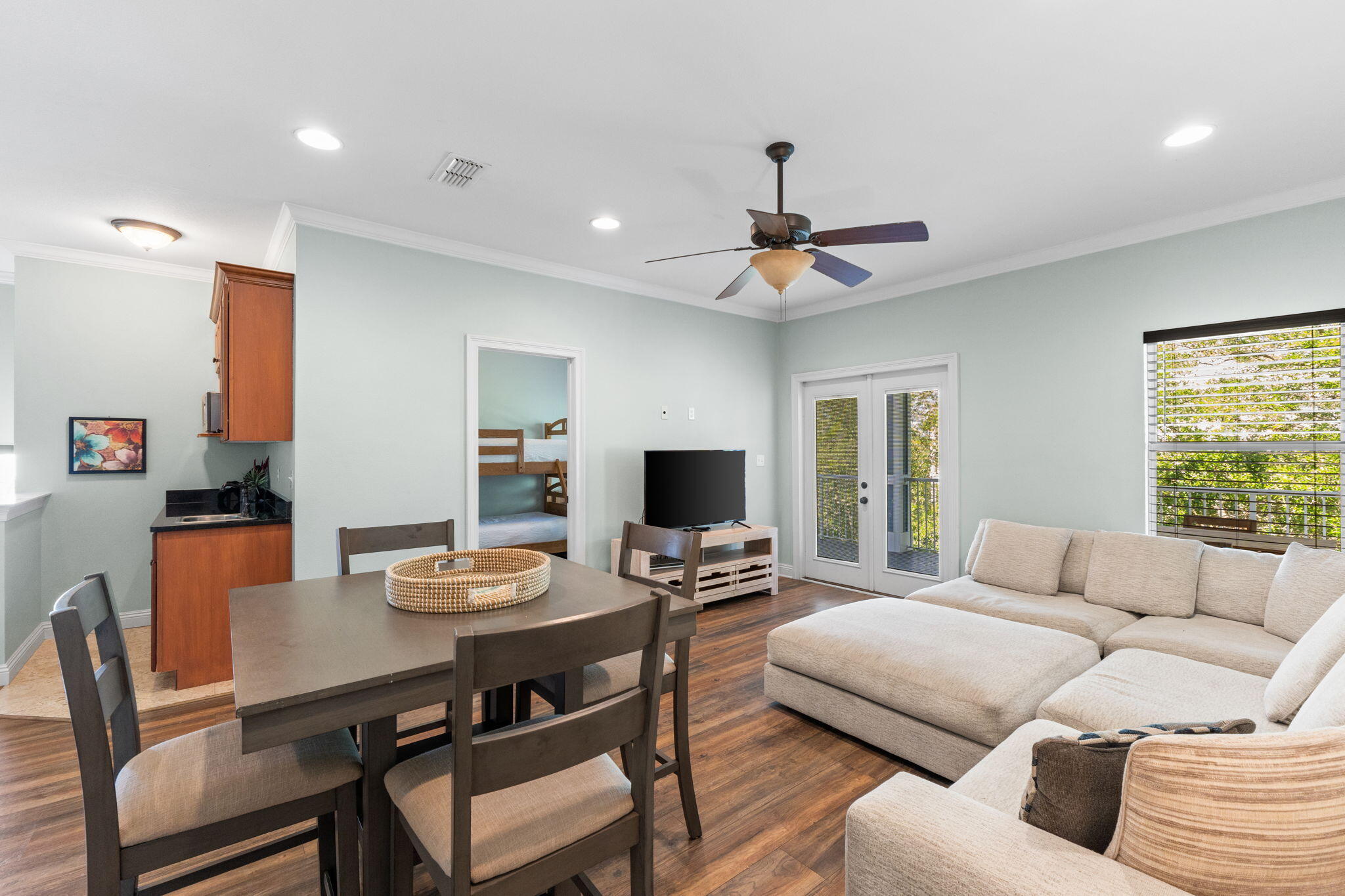209 Grand Key Loop East Destin, FL 32541 - Photo 36 of 59 a living room with furniture a flat screen tv and a table
