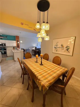 a dining room with furniture and window