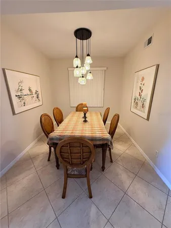 a bedroom with a bed and a lamp on table