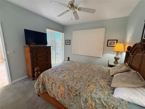 a bedroom with bed and window
