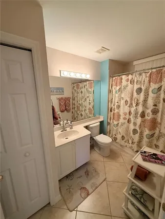 a room with wooden floor and furniture