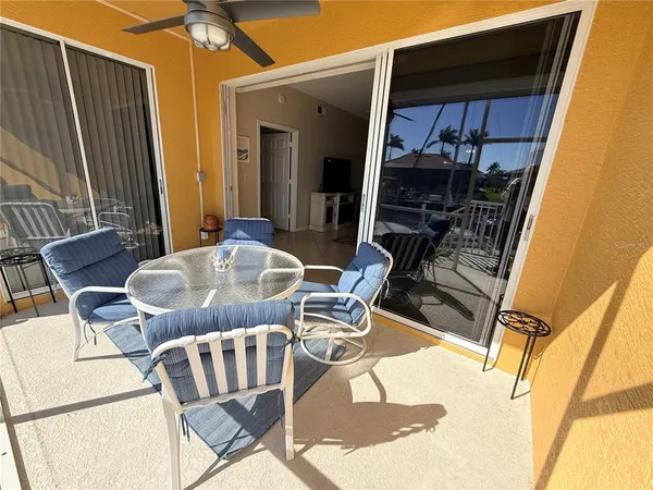a view of balcony with furniture