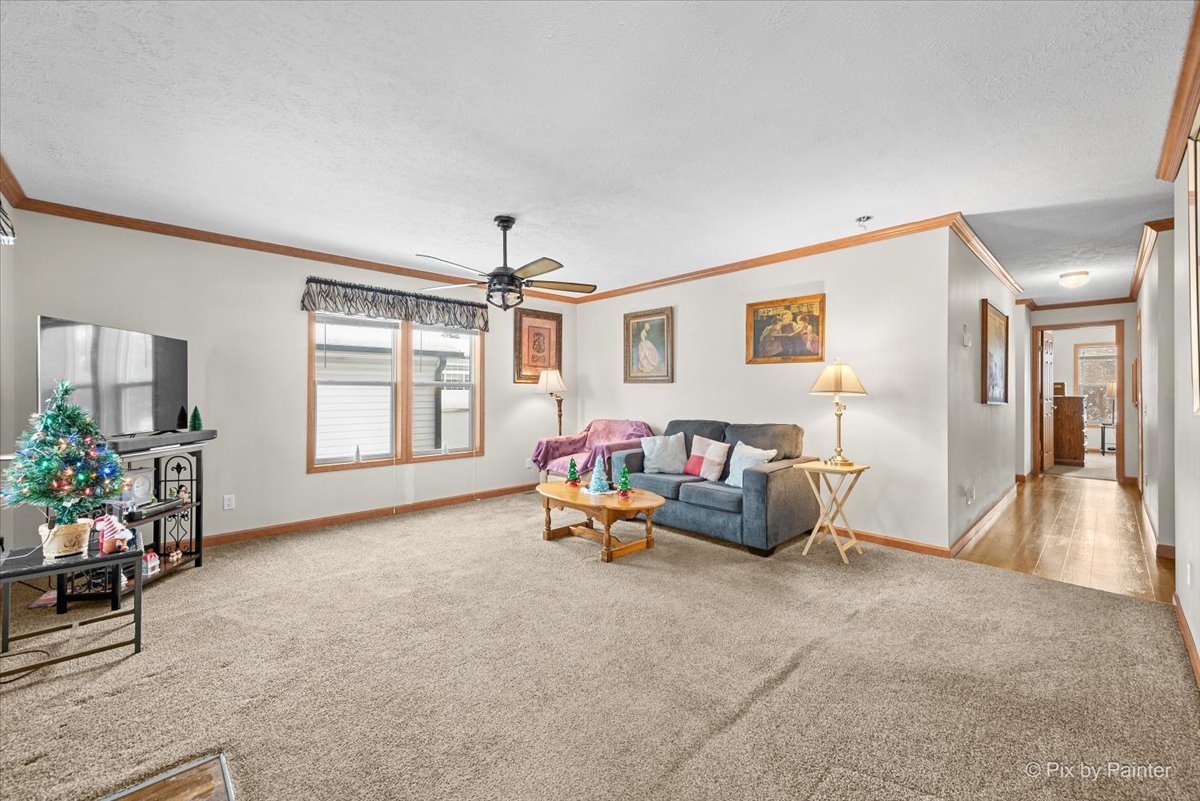 173 Northshore Road Elgin, IL 60123 - Photo 6 of 39 a living room with furniture and a window