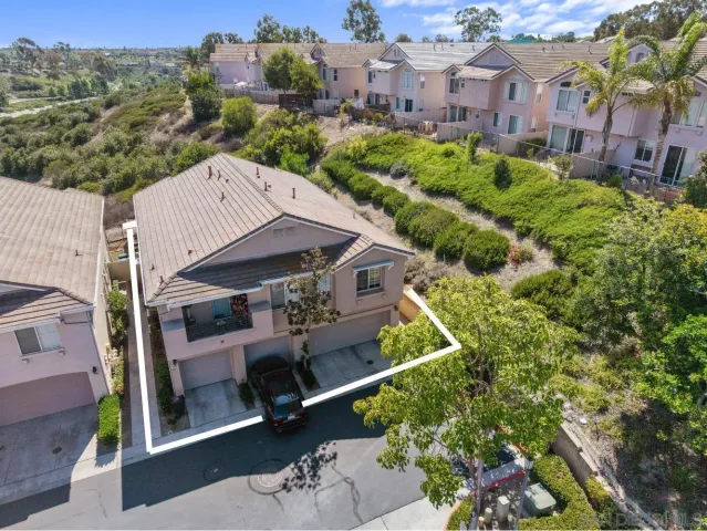 an aerial view of a house with a garden