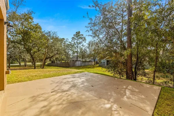 a view of swimming pool with trees in the background