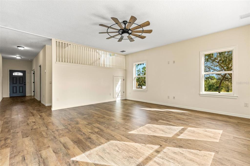 5332 West Westchase Loop Lecanto, FL 34461 - Photo 37 of 39 a view of a livingroom with a window and a ceiling fan