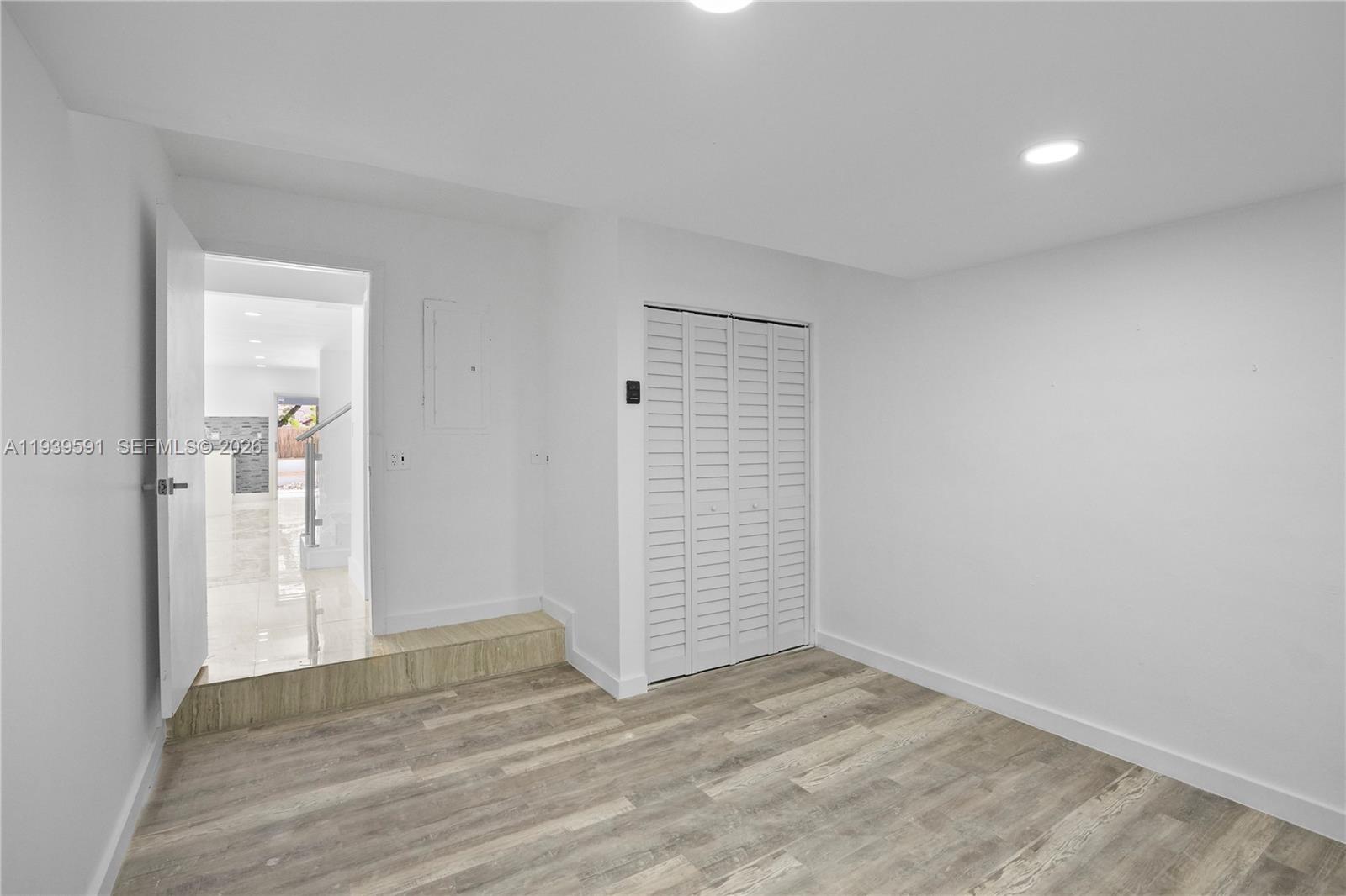 12894 Southwest 60th Terrace Miami, FL 33183 - Photo 18 of 66 wooden floor in an empty room