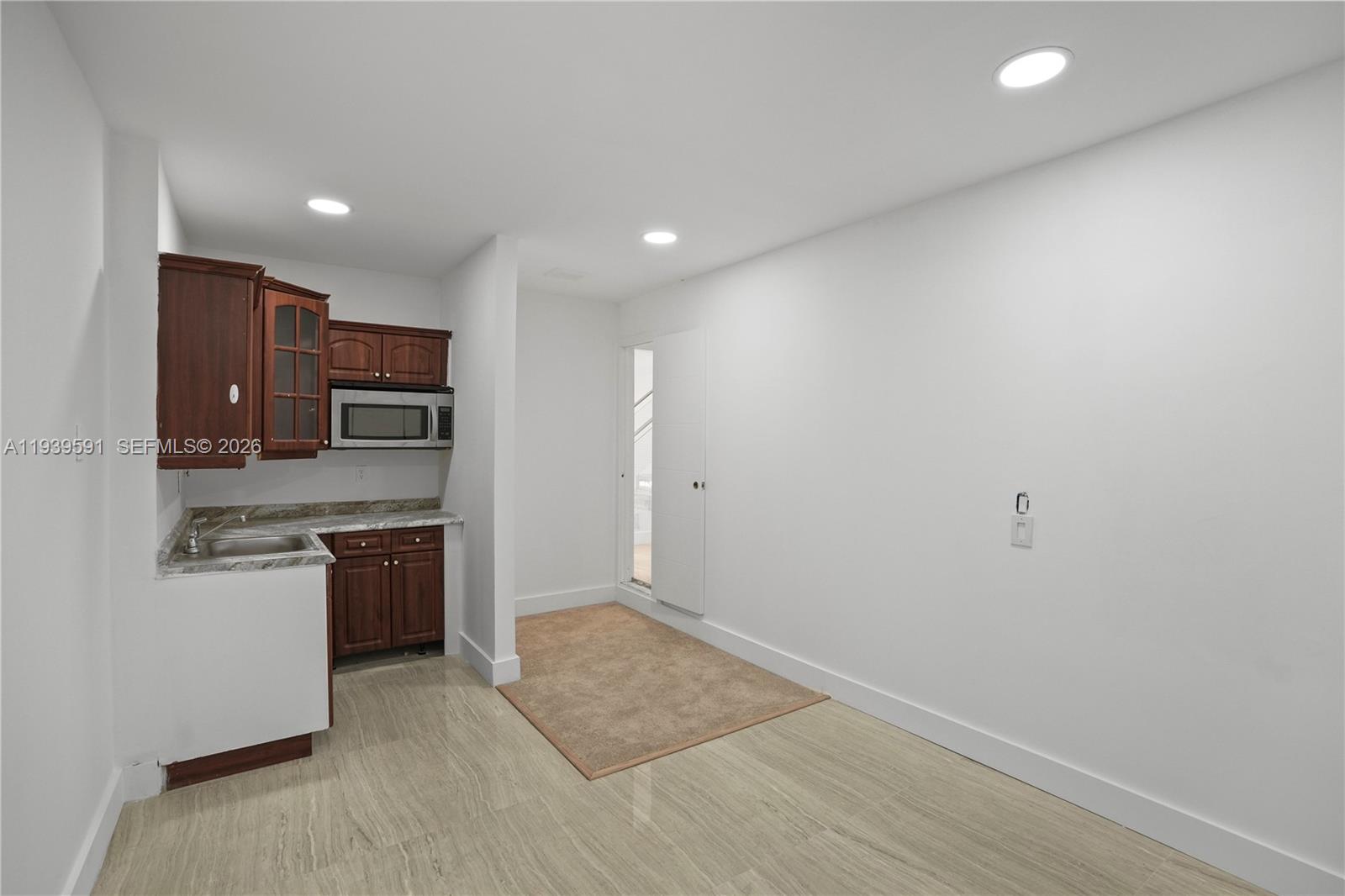 12894 Southwest 60th Terrace Miami, FL 33183 - Photo 21 of 66 a kitchen with stainless steel appliances granite countertop a refrigerator and a stove top oven